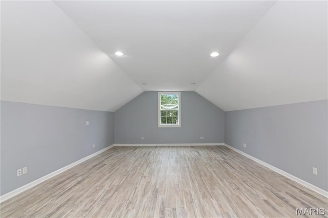 809 Star Ridge Ct, Defiance, MO 63341 - additional living space with light wood-style flooring, lofted ceiling, and recessed lighting