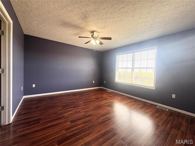 18410 Charity Dr, Dixon, MO 65459 - unfurnished room featuring ceiling fan, wood finished floors, baseboards, and a textured ceiling