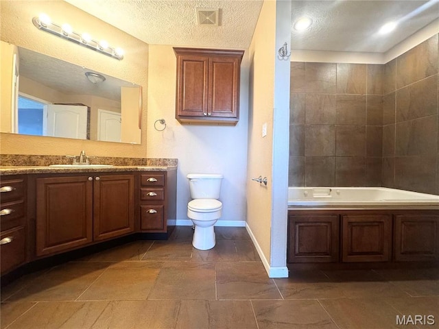 18410 Charity Dr, Dixon, MO 65459 - bathroom with toilet, baseboards, a tub, a textured ceiling, and vanity