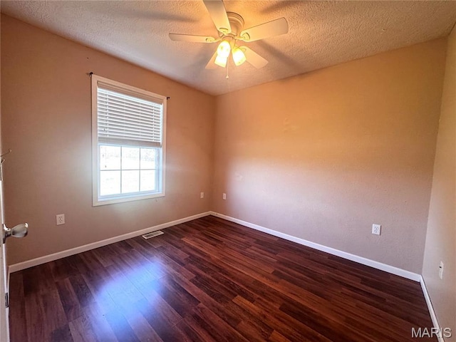18410 Charity Dr, Dixon, MO 65459 - unfurnished room featuring ceiling fan, dark wood-type flooring, baseboards, and a textured ceiling