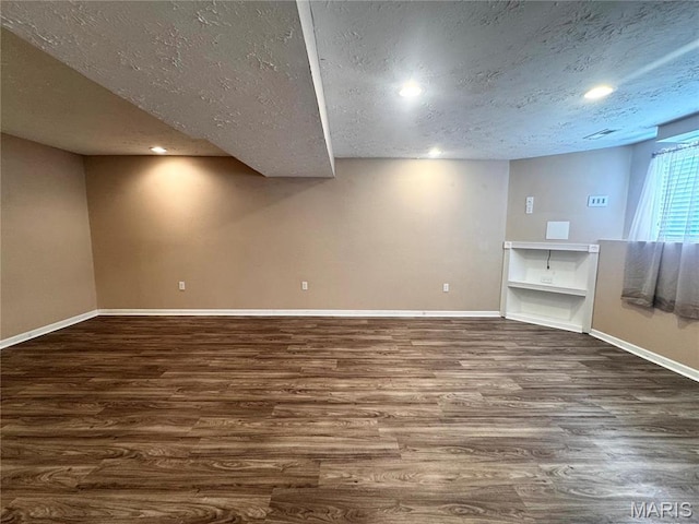18410 Charity Dr, Dixon, MO 65459 - basement with a textured ceiling, wood finished floors, baseboards, and recessed lighting