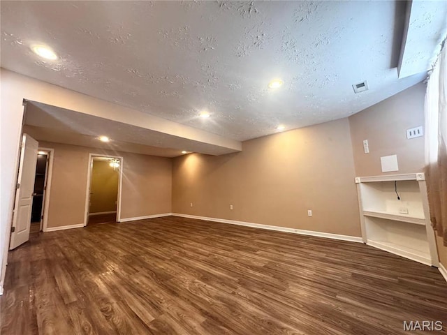 18410 Charity Dr, Dixon, MO 65459 - finished basement featuring wood finished floors, baseboards, a textured ceiling, recessed lighting, and built in shelves