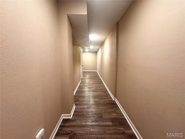 18410 Charity Dr, Dixon, MO 65459 - corridor with dark wood finished floors, a textured wall, and baseboards