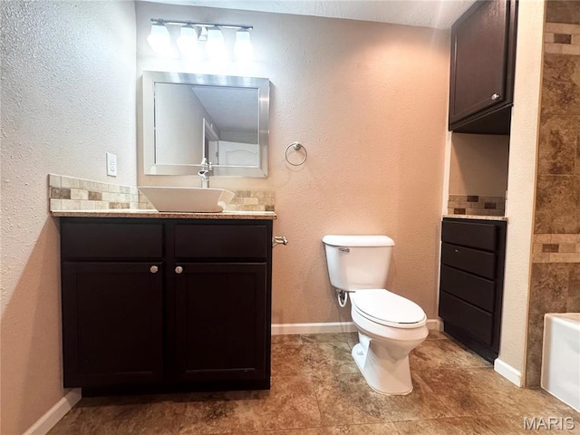 18410 Charity Dr, Dixon, MO 65459 - full bathroom with toilet, a bath, vanity, and baseboards