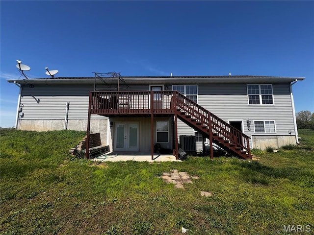 18410 Charity Dr, Dixon, MO 65459 - back of property with stairs, a deck, a yard, and central AC