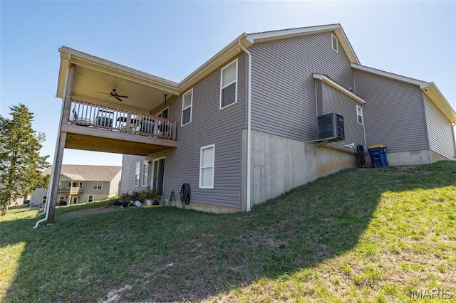 1869 Sunset Rdg, Festus, MO 63028 - rear view of house featuring ceiling fan, a lawn, and a balcony
