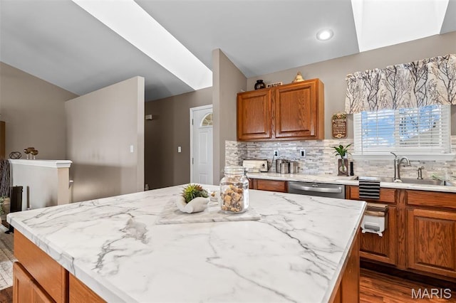 790 Isabella Ct, Farmington, MO 63640 - kitchen featuring vaulted ceiling, a sink, dark wood-style flooring, stainless steel dishwasher, and light stone countertops