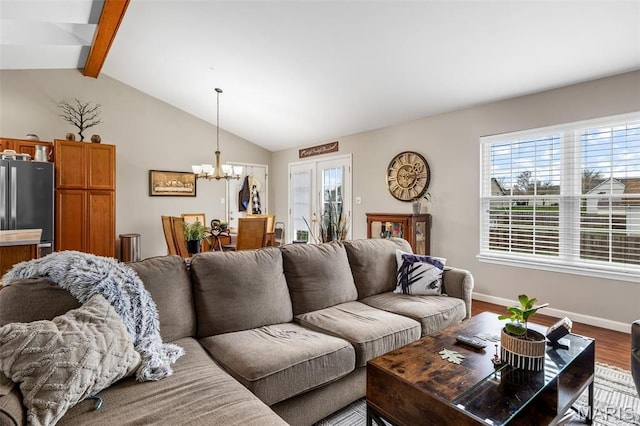 790 Isabella Ct, Farmington, MO 63640 - living room featuring a chandelier, wood finished floors, and baseboards