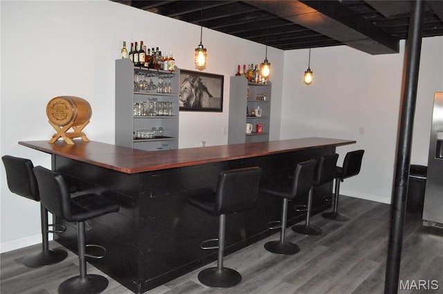 869 Destiny Dr, Villa Ridge, MO 63089 - indoor dry bar featuring dark wood finished floors and baseboards
