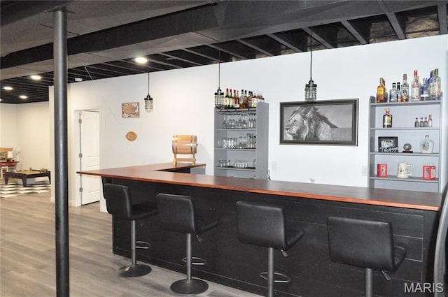 869 Destiny Dr, Villa Ridge, MO 63089 - indoor dry bar with wood finished floors