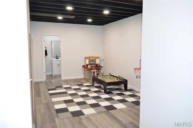 869 Destiny Dr, Villa Ridge, MO 63089 - rec room with light wood finished floors and baseboards