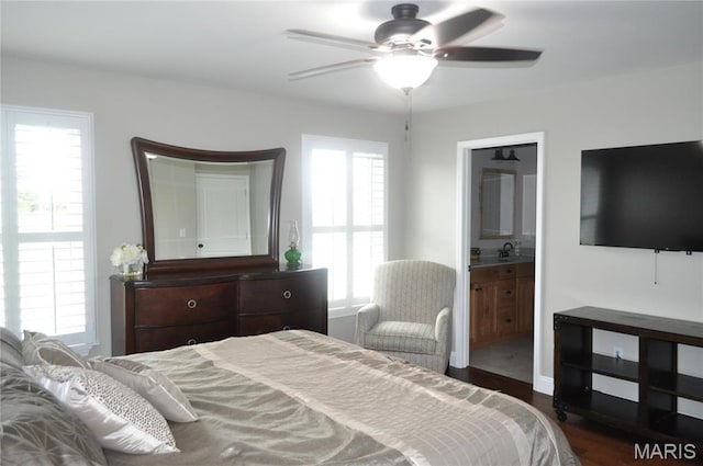 869 Destiny Dr, Villa Ridge, MO 63089 - bedroom with wood finished floors, a sink, a ceiling fan, and ensuite bathroom