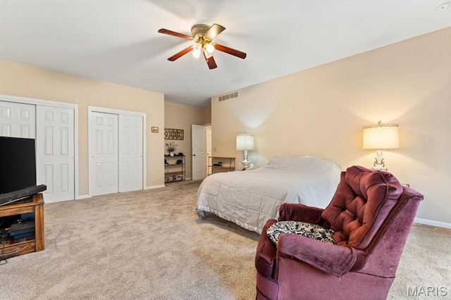 1029 Stonybrook Dr, Ofallon, IL 62269 - carpeted bedroom featuring multiple closets, baseboards, and ceiling fan