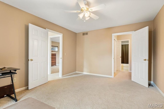1029 Stonybrook Dr, Ofallon, IL 62269 - unfurnished bedroom with light carpet, baseboards, and a ceiling fan