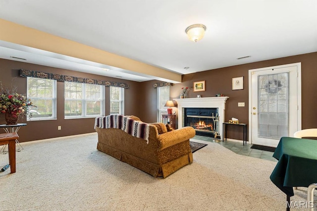 1029 Stonybrook Dr, Ofallon, IL 62269 - living area featuring a fireplace with flush hearth, plenty of natural light, and baseboards