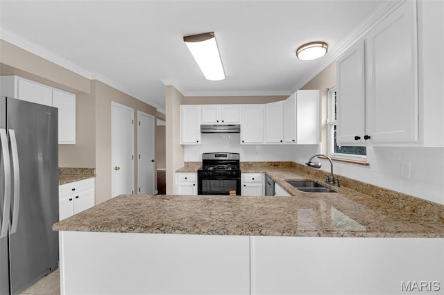 7 Park City Ct, Ofallon, MO 63368 - kitchen with black gas range oven, freestanding refrigerator, a sink, under cabinet range hood, and light stone countertops
