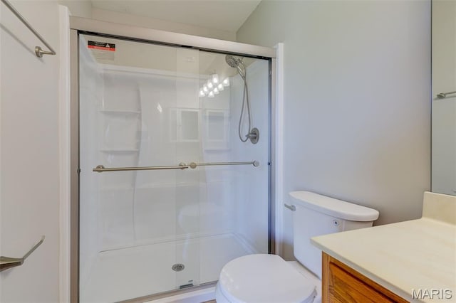 7 Park City Ct, Ofallon, MO 63368 - bathroom featuring a stall shower, vanity, and toilet