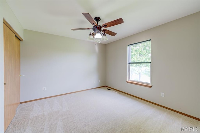 7 Park City Ct, Ofallon, MO 63368 - spare room with baseboards, light colored carpet, and a ceiling fan