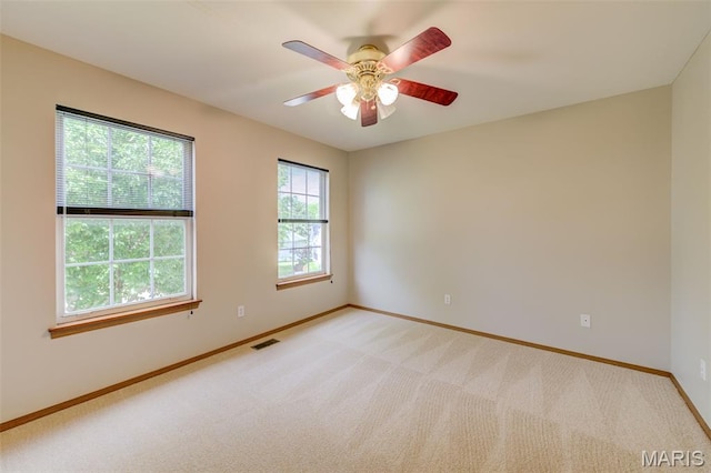 7 Park City Ct, Ofallon, MO 63368 - unfurnished room featuring baseboards, light colored carpet, and ceiling fan