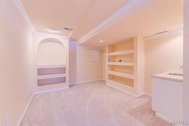 7 Park City Ct, Ofallon, MO 63368 - hall with crown molding, built in shelves, baseboards, and light carpet