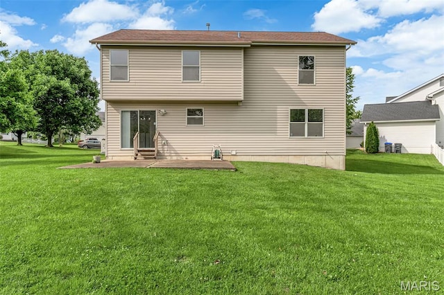 7 Park City Ct, Ofallon, MO 63368 - back of house featuring a patio and a lawn