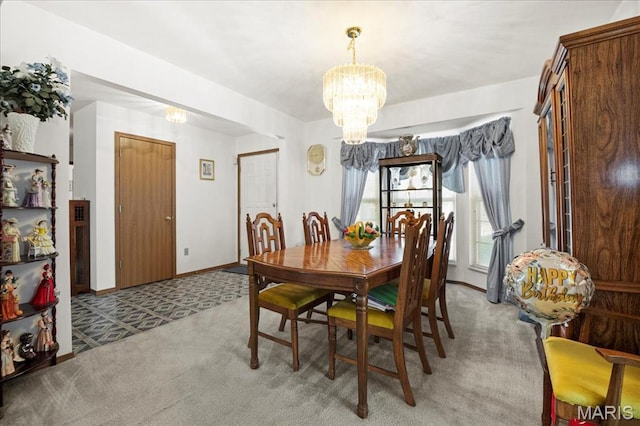 13011 Mystic Bend Ln, Black Jack, MO 63033 - dining space featuring a chandelier, light colored carpet, and baseboards