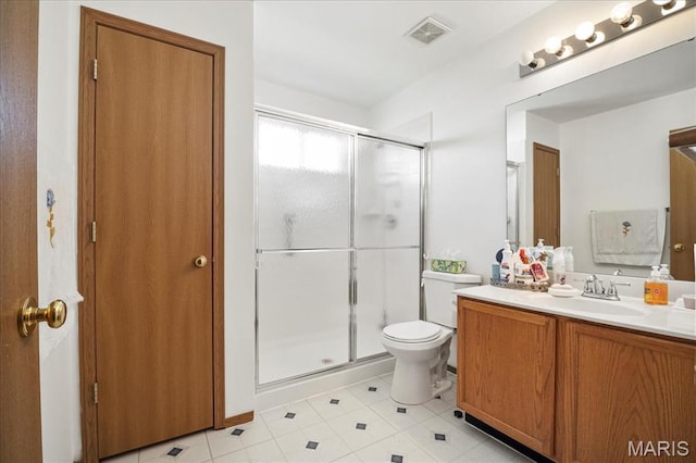 13011 Mystic Bend Ln, Black Jack, MO 63033 - full bathroom featuring a shower stall, vanity, toilet, and tile patterned floors