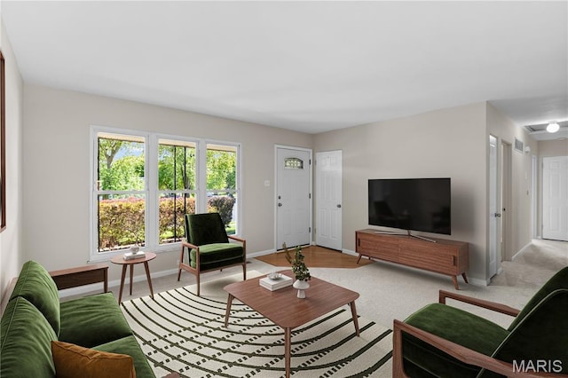 1630 Bobbinray Ave, Florissant, MO 63031 - carpeted living area featuring baseboards