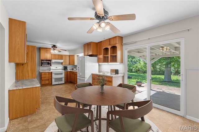 1630 Bobbinray Ave, Florissant, MO 63031 - dining area with a ceiling fan, light tile patterned floors, and baseboards