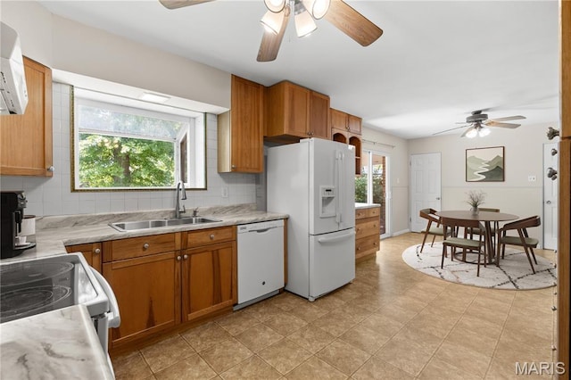 1630 Bobbinray Ave, Florissant, MO 63031 - kitchen with white appliances, a sink, a ceiling fan, and plenty of natural light