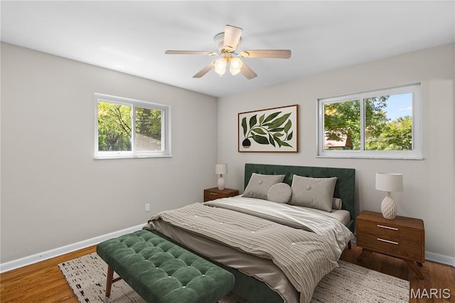 1630 Bobbinray Ave, Florissant, MO 63031 - bedroom featuring baseboards, wood finished floors, and a ceiling fan