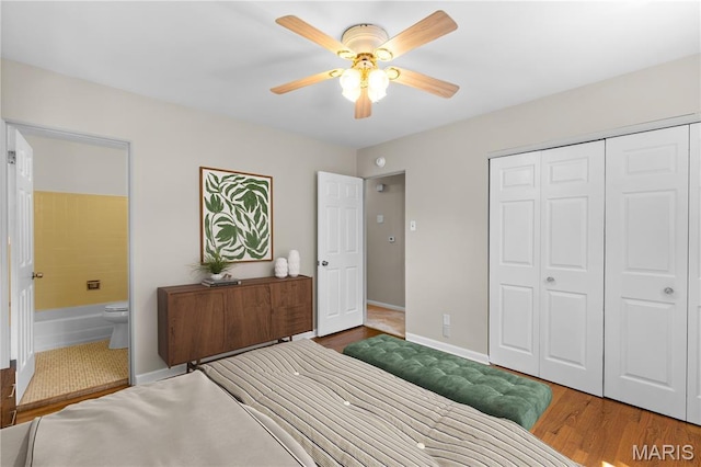 1630 Bobbinray Ave, Florissant, MO 63031 - bedroom featuring wood finished floors, a closet, connected bathroom, and ceiling fan