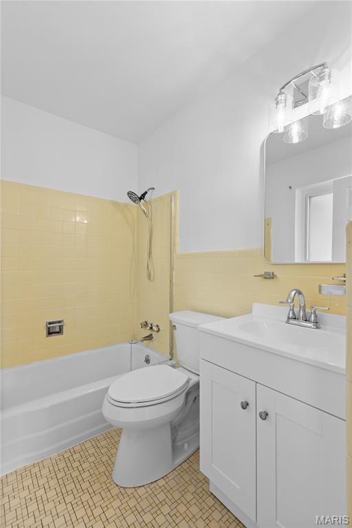 1630 Bobbinray Ave, Florissant, MO 63031 - full bathroom with vanity, toilet, bathing tub / shower combination, and tile walls