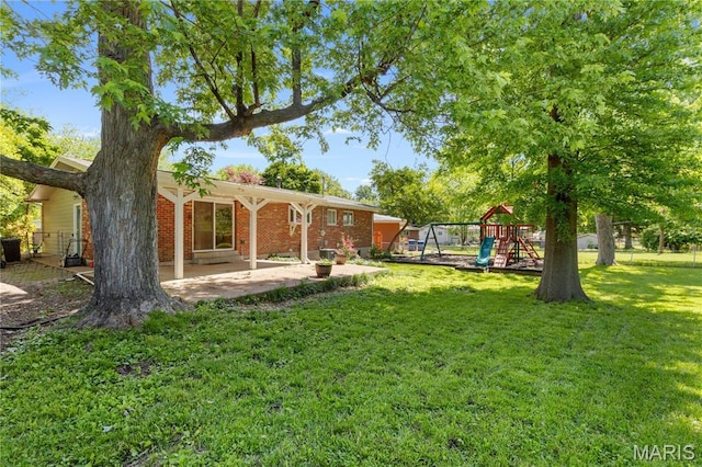 1630 Bobbinray Ave, Florissant, MO 63031 - view of yard featuring a patio area and a playground