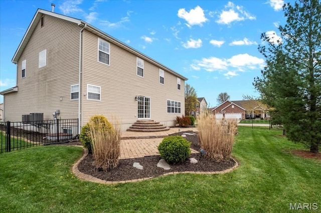 back of house featuring a patio area and central air condition unit