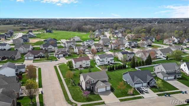 aerial perspective of suburban area featuring a tree filled landscape
