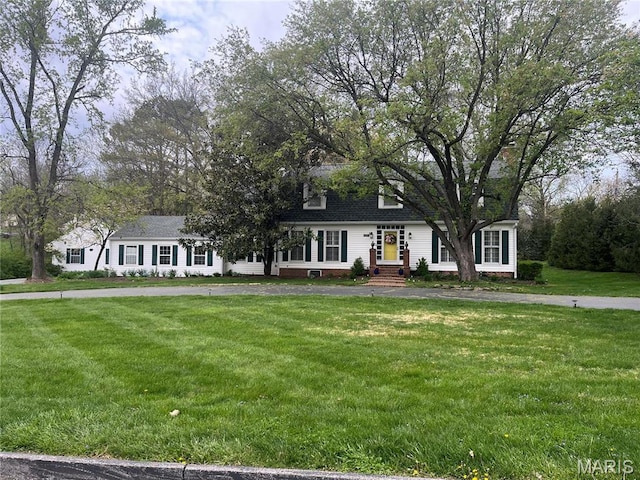1843 Manor Hill Rd, Saint Louis, MO 63131 - new england style home featuring a front lawn, roof with shingles, and entry steps