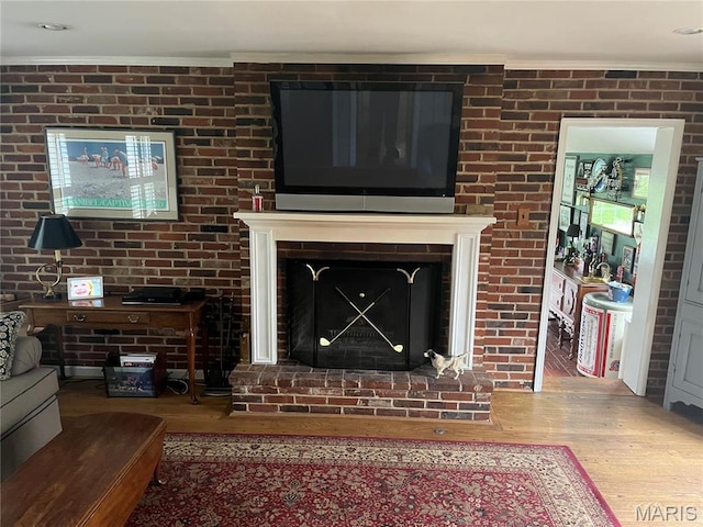 1843 Manor Hill Rd, Saint Louis, MO 63131 - detailed view of wood finished floors, crown molding, and a fireplace
