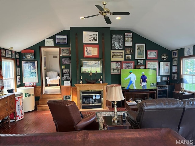 1843 Manor Hill Rd, Saint Louis, MO 63131 - living room with lofted ceiling, brick flooring, a glass covered fireplace, and ceiling fan