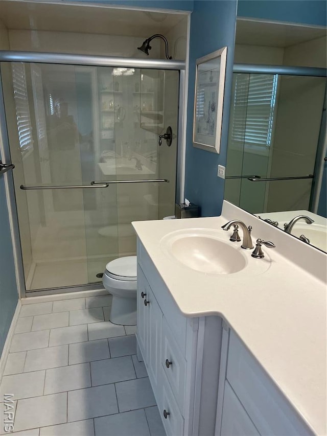 1843 Manor Hill Rd, Saint Louis, MO 63131 - full bath with tile patterned floors, toilet, vanity, and a shower stall