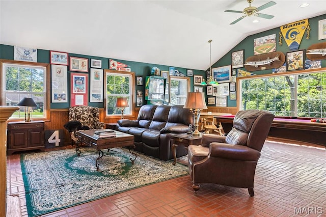 1843 Manor Hill Rd, Saint Louis, MO 63131 - living area featuring a wainscoted wall, ceiling fan, vaulted ceiling, brick flooring, and wooden walls