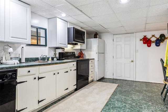 1843 Manor Hill Rd, Saint Louis, MO 63131 - kitchen featuring black appliances, dark countertops, white cabinetry, a sink, and a paneled ceiling