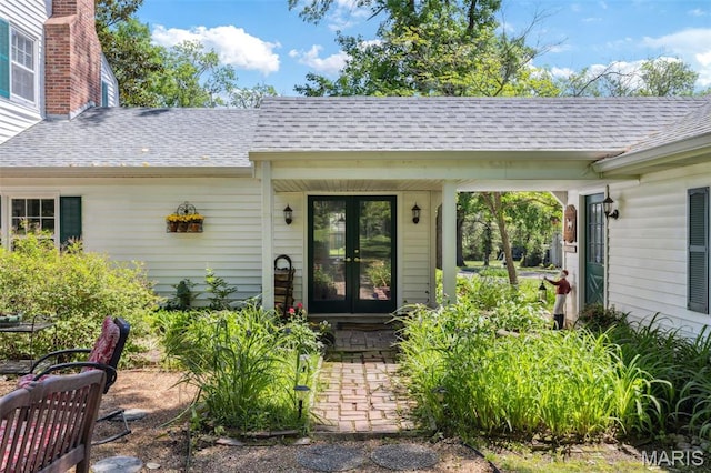 1843 Manor Hill Rd, Saint Louis, MO 63131 - property entrance featuring french doors, a shingled roof, and a chimney