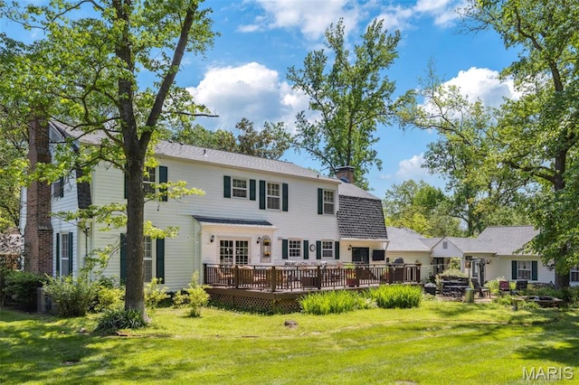1843 Manor Hill Rd, Saint Louis, MO 63131 - back of property with a deck, a yard, and a chimney