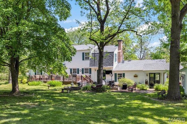 1843 Manor Hill Rd, Saint Louis, MO 63131 - back of property with a yard, a deck, a patio area, and a chimney