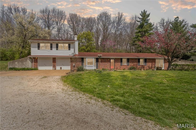 26152 Beltrees Rd, Dow, IL 62022 - view of front of property with dirt driveway, brick siding, an attached garage, a chimney, and a front lawn