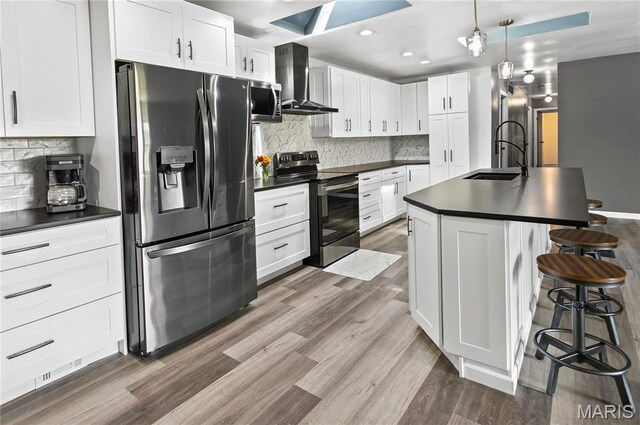 26152 Beltrees Rd, Dow, IL 62022 - kitchen featuring stainless steel appliances, wall chimney range hood, dark countertops, backsplash, and recessed lighting
