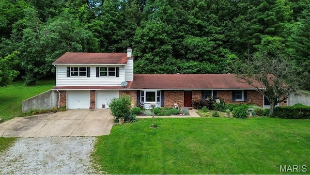 26152 Beltrees Rd, Dow, IL 62022 - view of front of house with concrete driveway, brick siding, a front yard, an attached garage, and a chimney