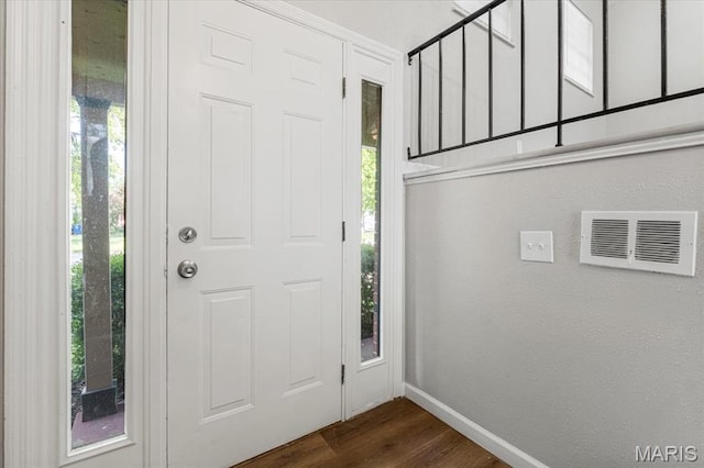2145 Glenoro Dr, Florissant, MO 63033 - foyer entrance featuring baseboards and dark wood-style flooring