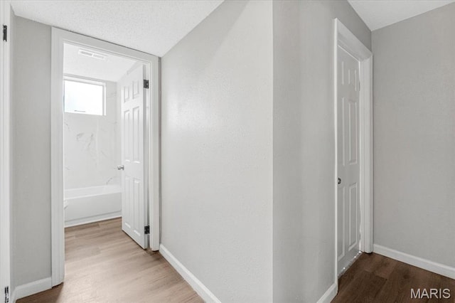 2145 Glenoro Dr, Florissant, MO 63033 - hall featuring wood finished floors and baseboards